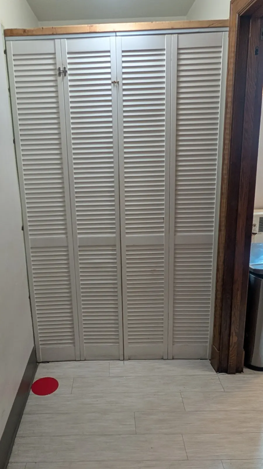 Accordion doors enclosing the washer and dryer