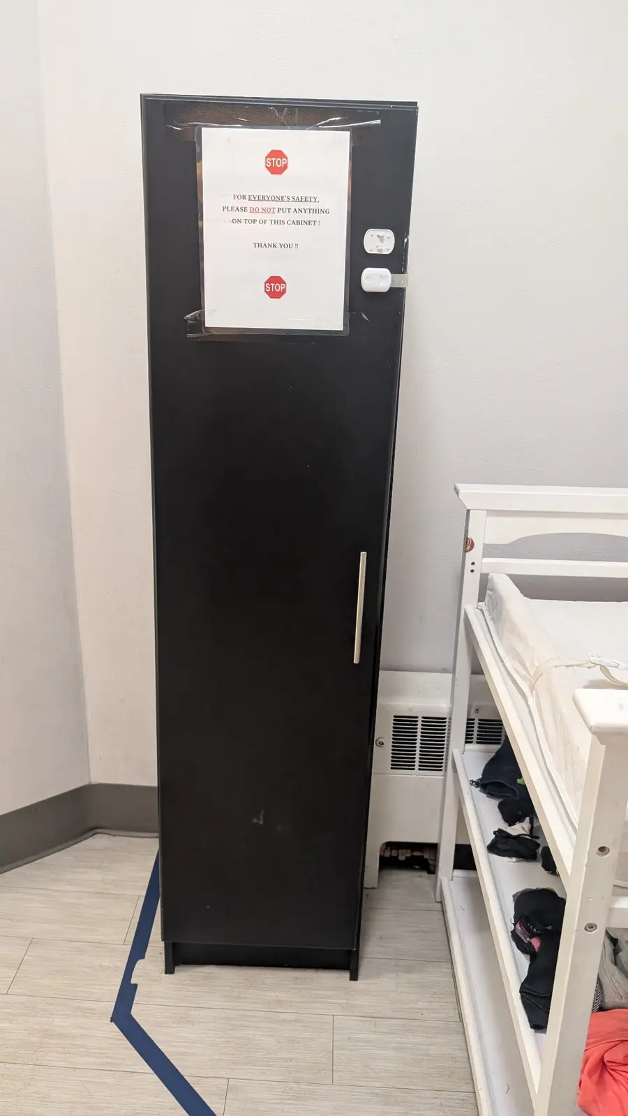 Locked cabinet beside the changing table